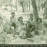 Mom Center with Rudy on Lap, from right, Grandpa, Ma's Cousin Celia, Al Jr., Betty with bottle and Joe circa 1946