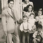 Monterrey, MX home. Pa, cousin Concha top, Ma with baby Rudy. Betty next to Ma, Al next to Pa, cousin Carru on step, 1945